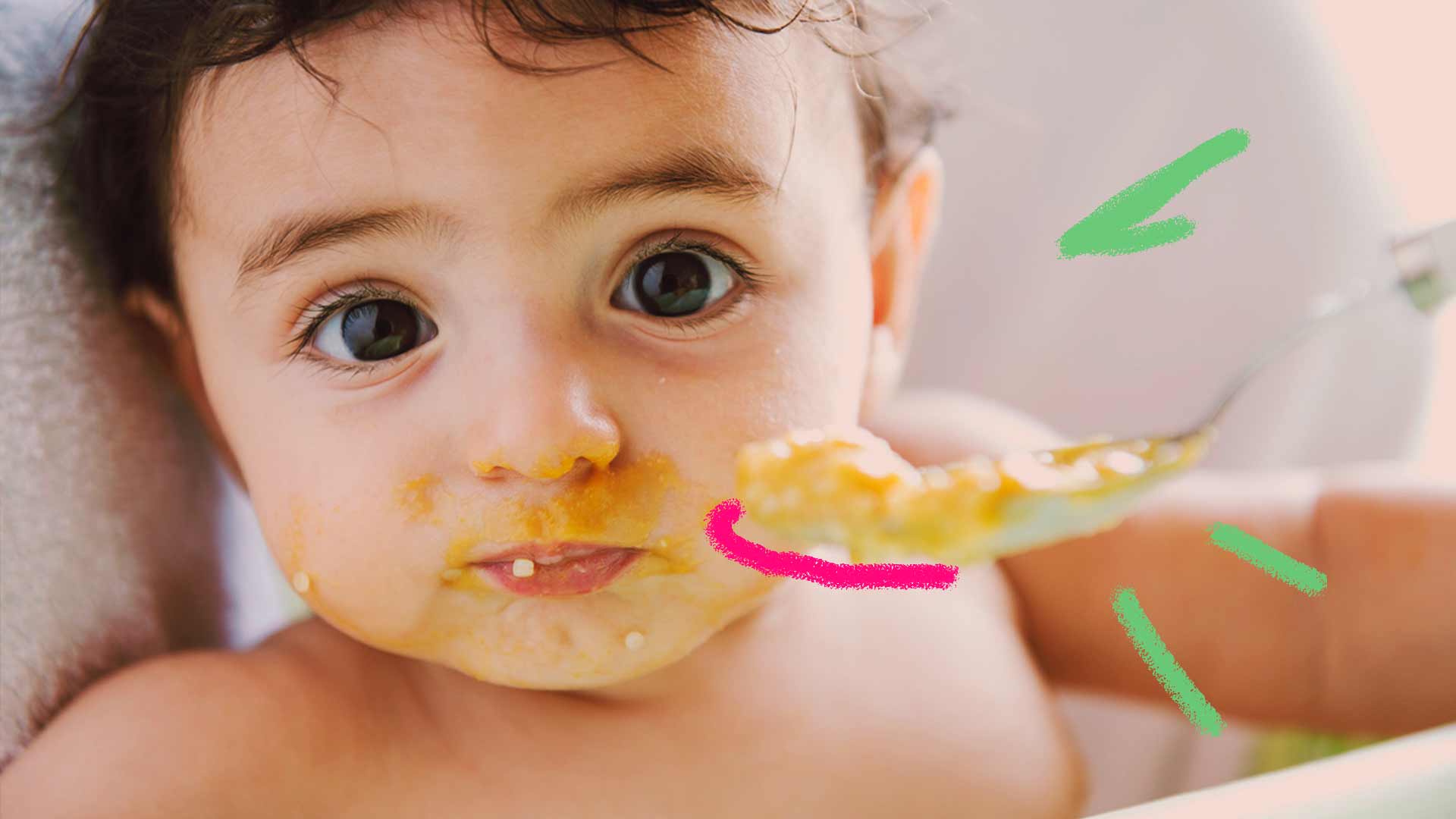 Baby exploring solid foods in high chair with mom watching