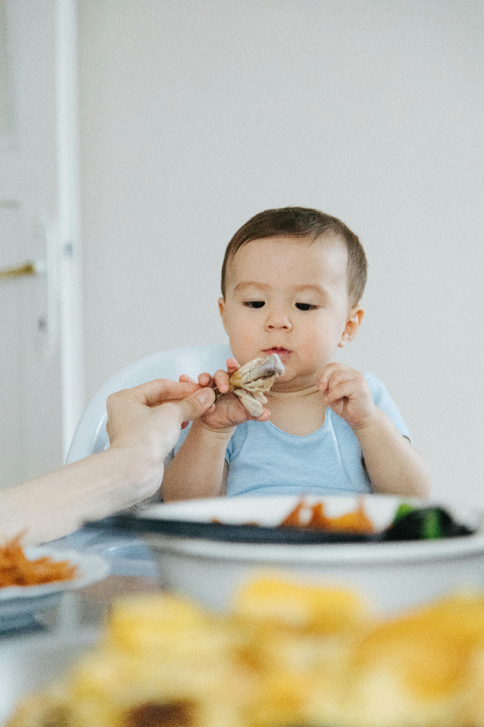 Baby eating finger foods with hands — real solid food journey